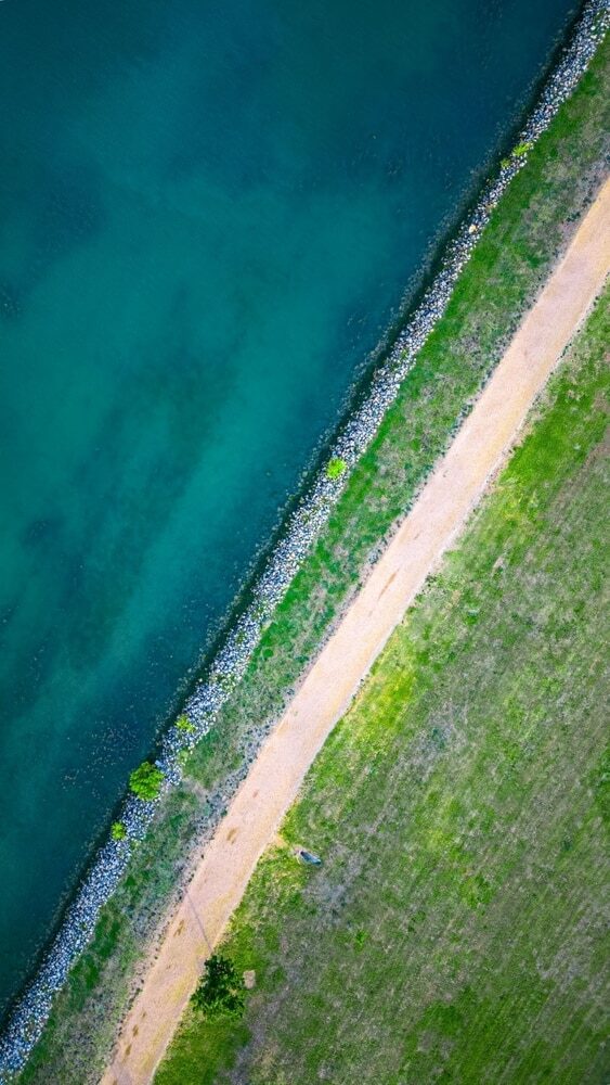 A person trail running on a scenic path in Pflugerville, TX