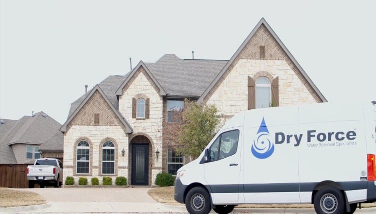 Dry Force Water Removal Truck Parked outside home
